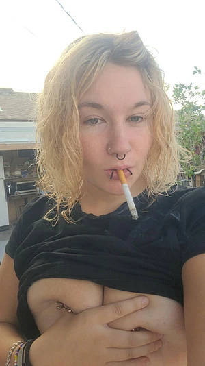 Tits out smoking outside hoping that a roommate walks out and sees me