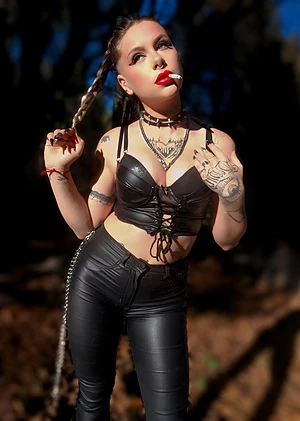 Leather, red lipstick, and a cigarette. Perfect combo