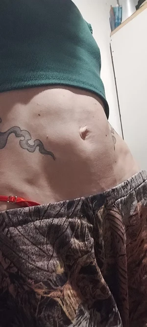 Tattoos on my skinny belly. I love them